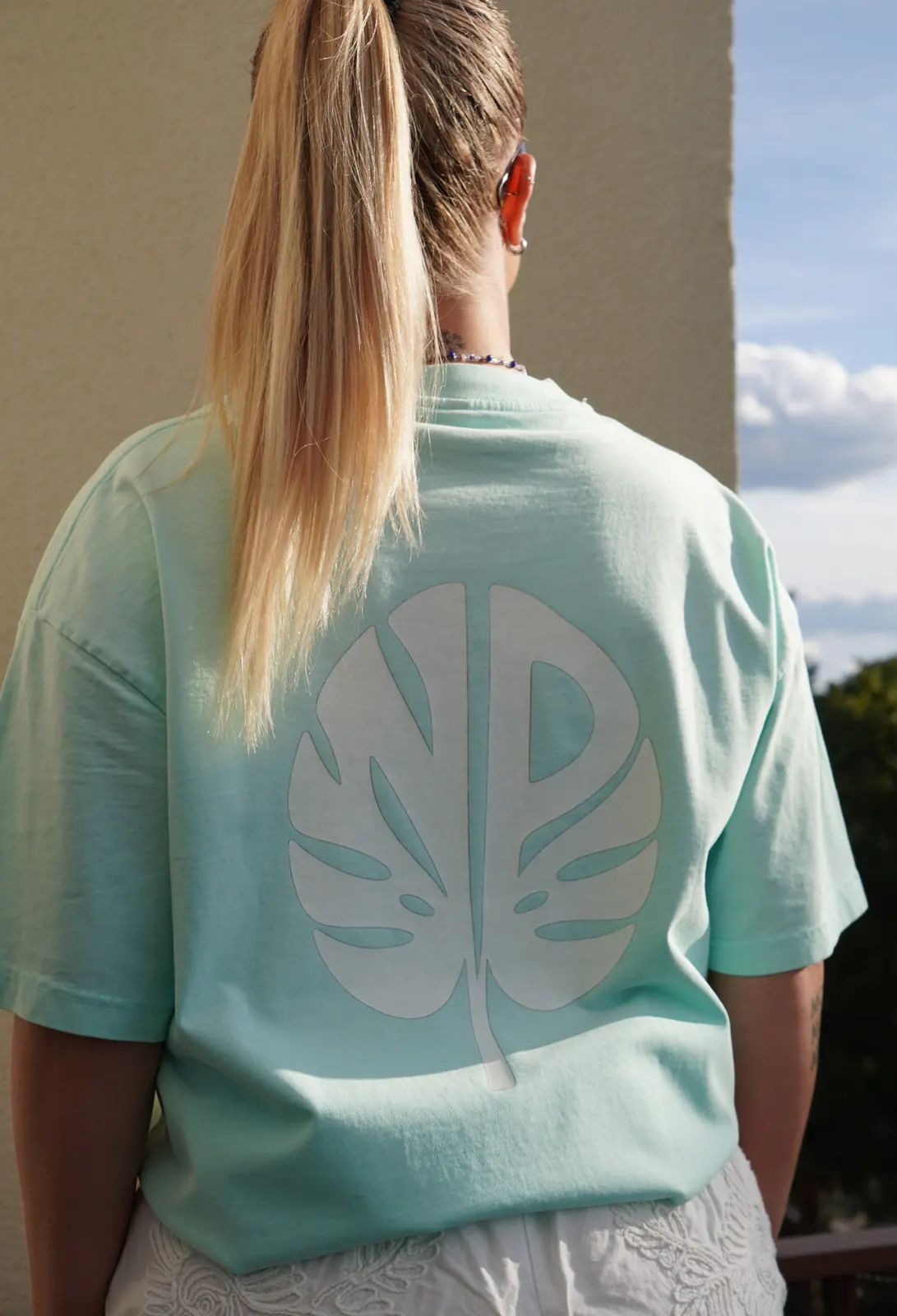 Natural Progression blue T-shirt with large leaf back print