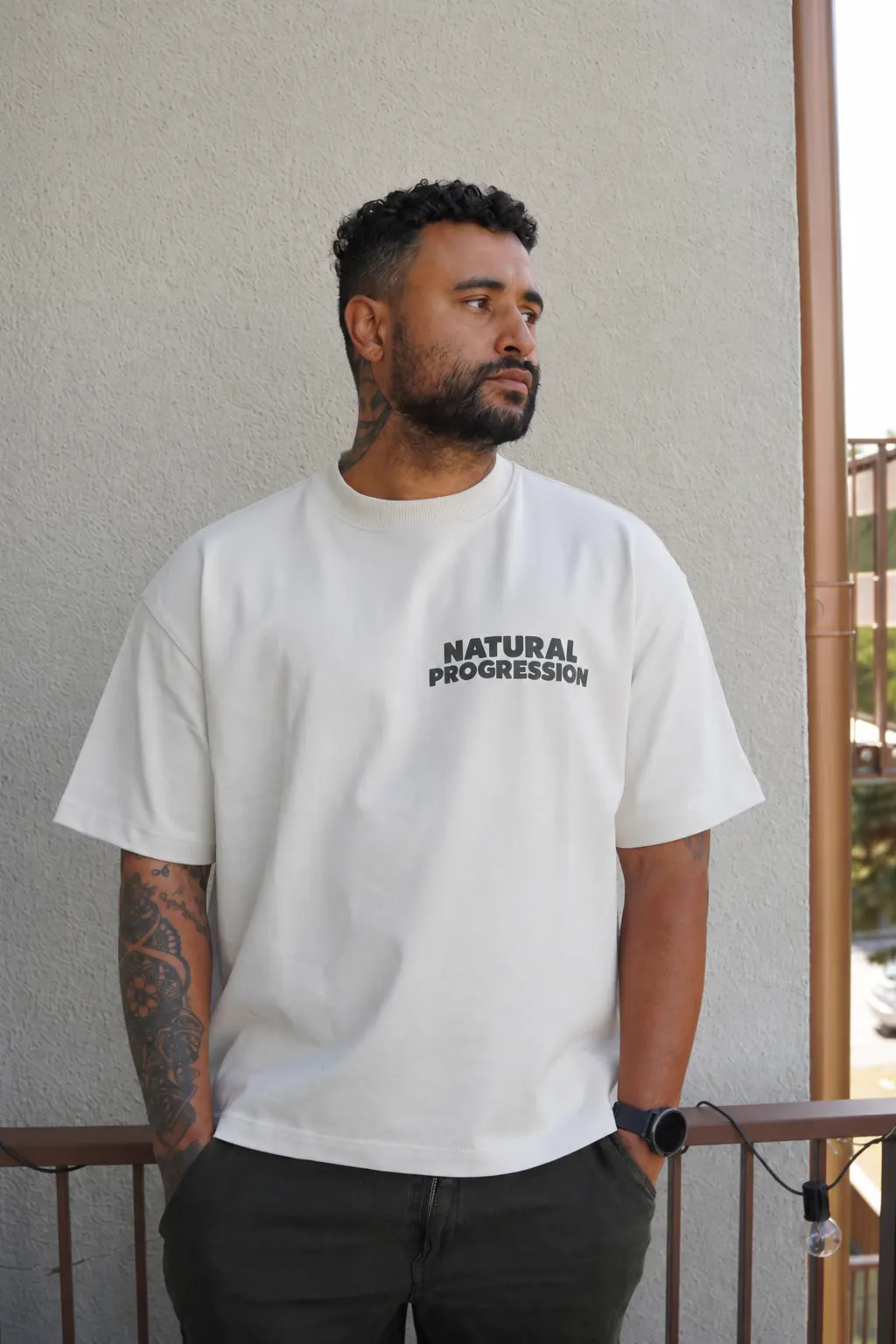 Natural Progression cream T-shirt worn outdoors